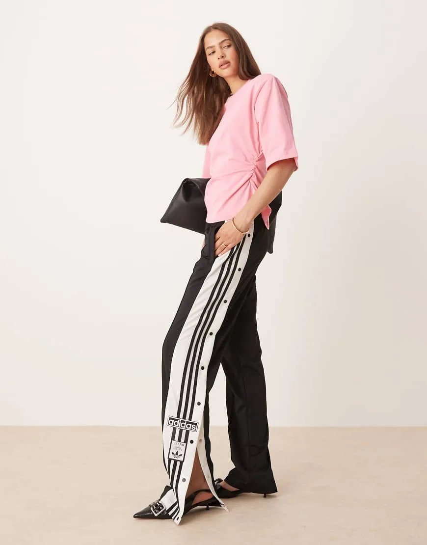 adidas Originals Adibreak track pants in black sold by ASOS
