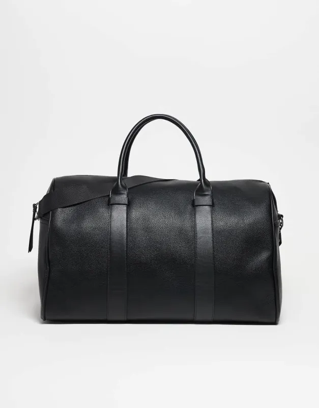 ASOS DESIGN faux leather holdall bag in black made by ASOS