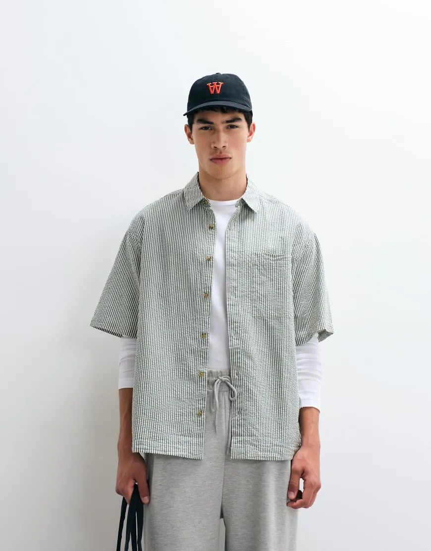 ASOS DESIGN oversized seersucker stripe shirt in green sold by ASOS