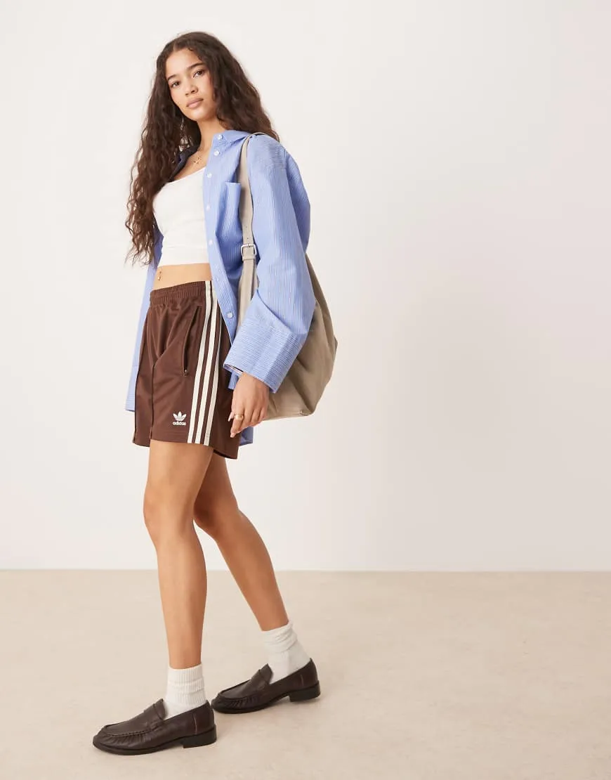 adidas Originals Firebird shorts in brown sold by ASOS