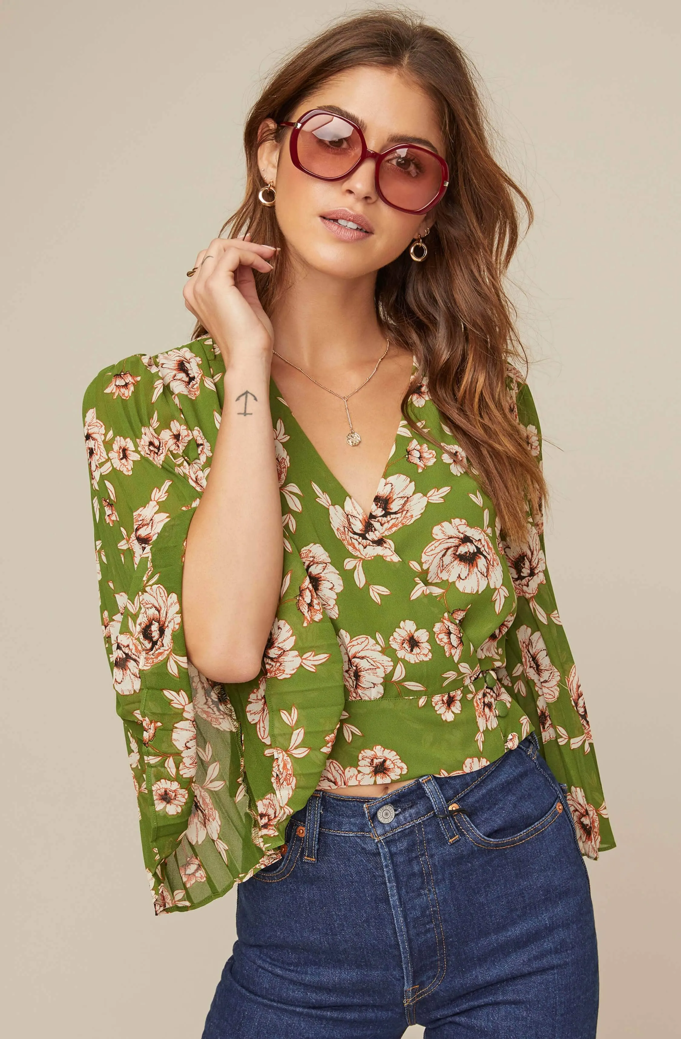 Pleated Sleeve Floral Wrap Top sold by Astr