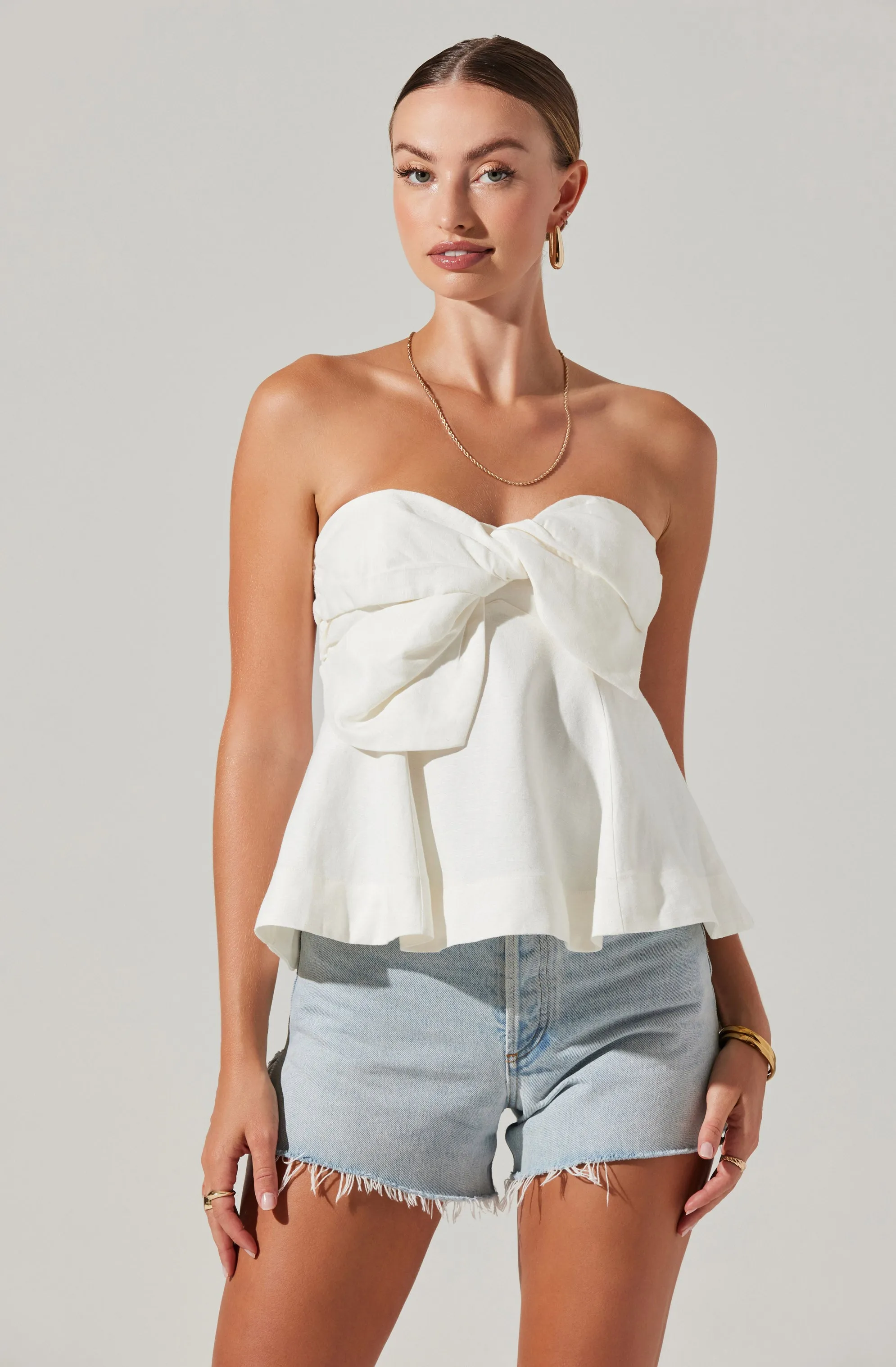 Nerina Twist Front Strapless Top sold by Astr