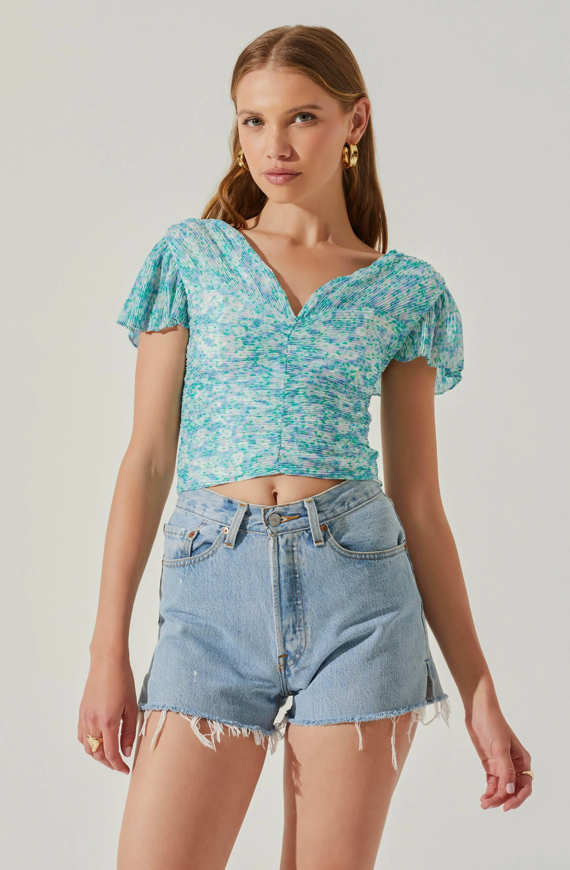 V-neck Plisse Bust Floral Top sold by Astr
