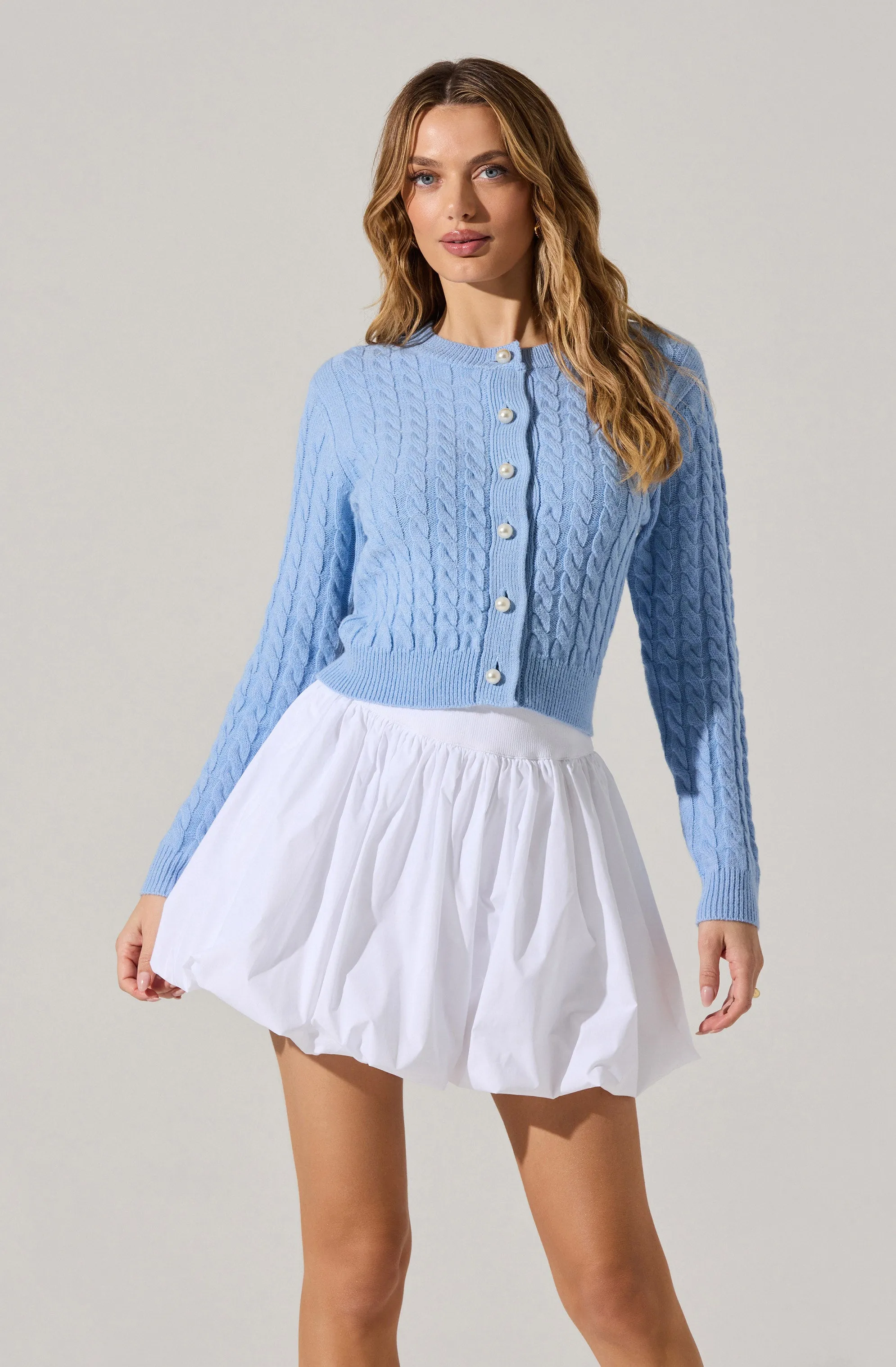 Pearl Button Cable Knit Cardigan sold by Astr