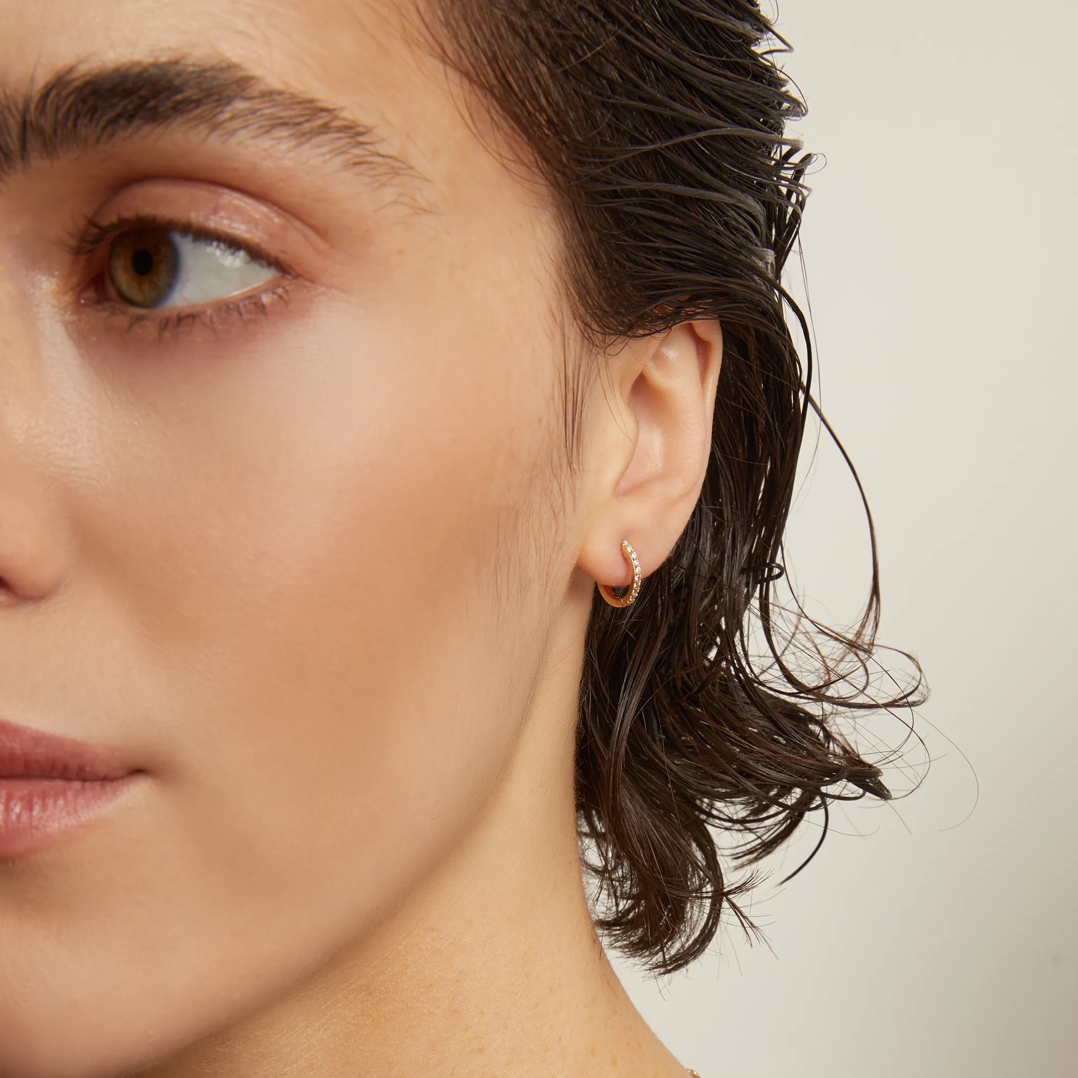 Petite Lab Grown White Sapphire Huggie Earrings sold by Aurate product image thumbnail 4