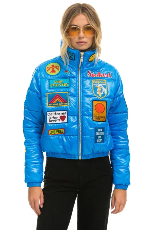 VINTAGE PATCH APRES PUFFER JACKET - BLUE CINA GLOSSY sold by Aviator Nation