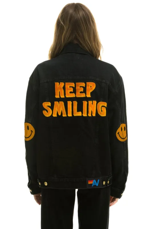 KEEP SMILING OVERSIZED CONCERT DENIM JACKET - VINTAGE BLACK sold by Aviator Nation