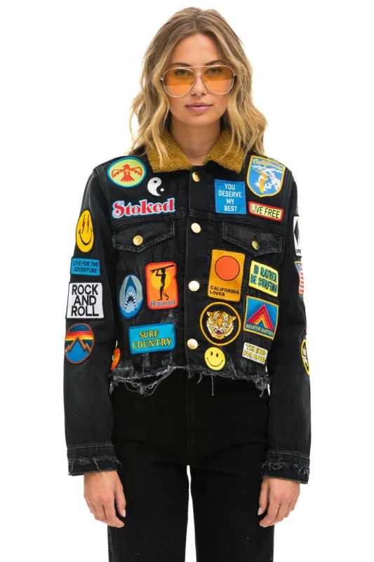 WCS: VINTAGE PATCH UNISEX CROP DENIM JACKET - VINTAGE BLACK sold by Aviator Nation
