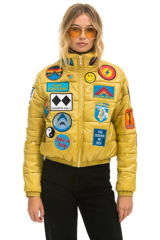 VINTAGE PATCH APRES PUFFER JACKET - HONEY GLOSSY sold by Aviator Nation