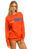 RIDE LOGO CREW SWEATSHIRT - ORANGE sold by Aviator Nation