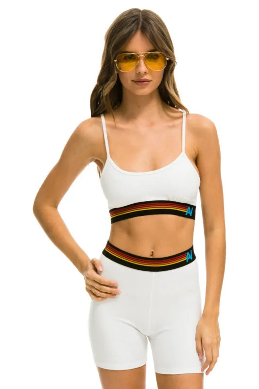 MEMBER EXCLUSIVE: LOGO 4 INCH HI-RISE BIKER SHORT - WHITE sold by Aviator Nation