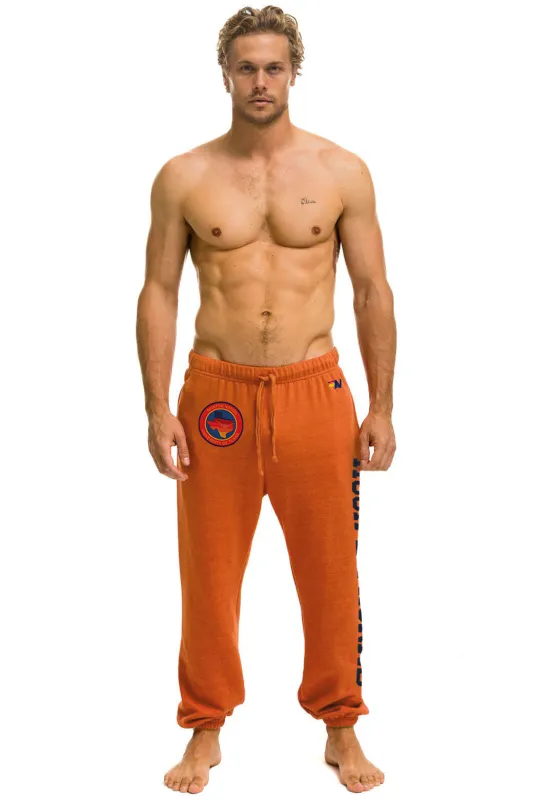 UNIVERSITY OF TEXAS UNISEX CIRCLE PRINT SWEATPANTS - BURNT ORANGE sold by Aviator Nation