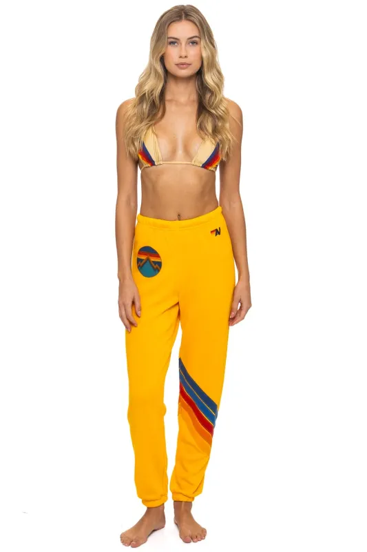 ALL SEASONS CIRCLE CHEVRON SWEATPANTS - GOLD sold by Aviator Nation