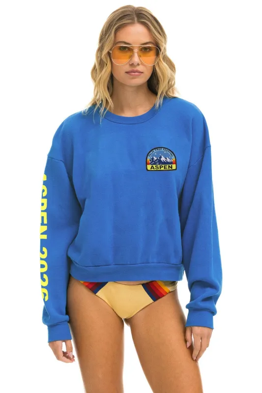 PALM TREE FEST ASPEN 2026 CREW SWEATSHIRT RELAXED - COBALT made by Aviator Nation