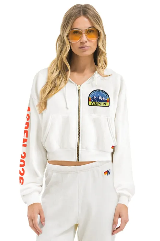 PALM TREE FEST ASPEN 2026 CROPPED ZIP HOODIE RELAXED - WHITE sold by Aviator Nation