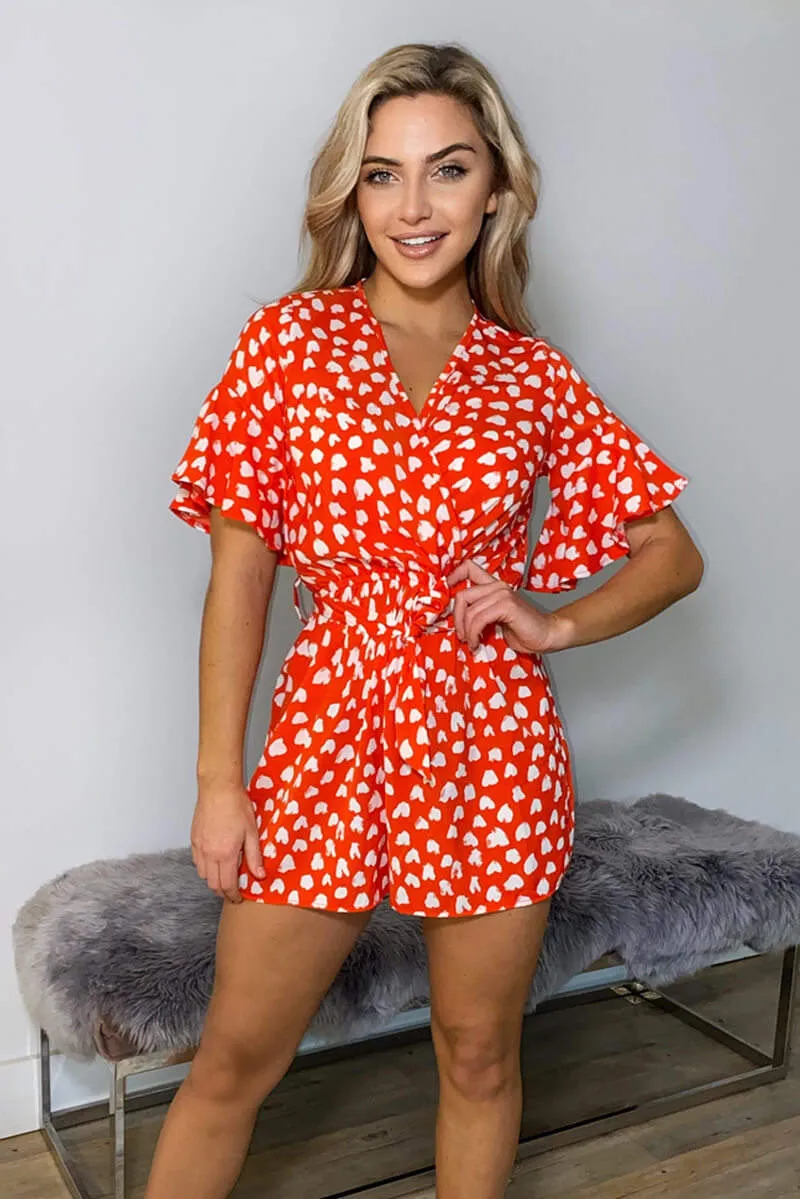 Red Heart Print Wrap Playsuit sold by AX Paris