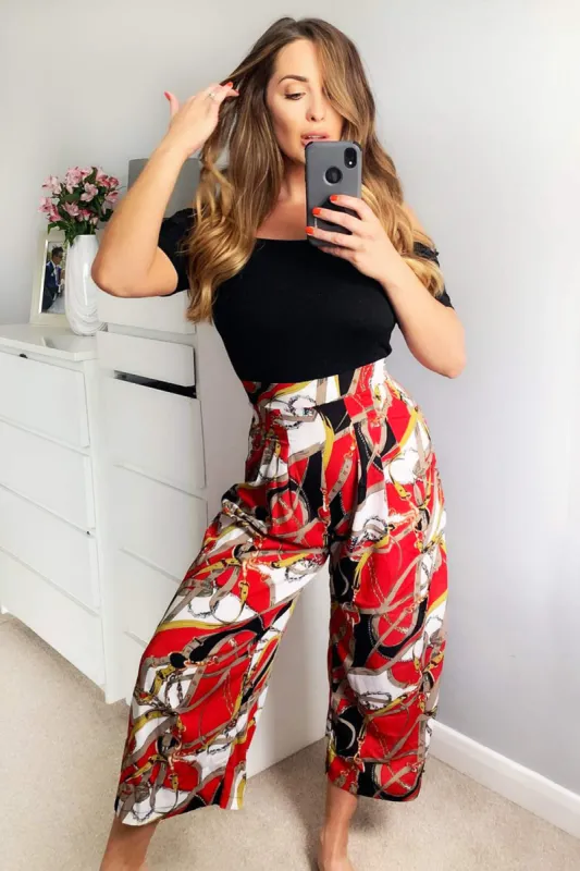 Red Chain Print Bardot Jumpsuit sold by AX Paris