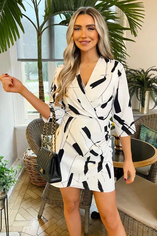 Black And White Printed Wrap Top Mini Dress sold by AX Paris