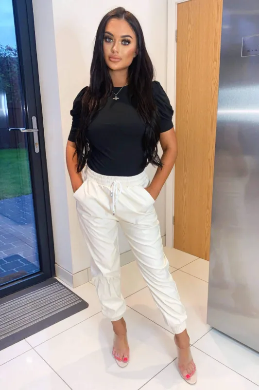 Ecru Faux Leather Joggers sold by AX Paris