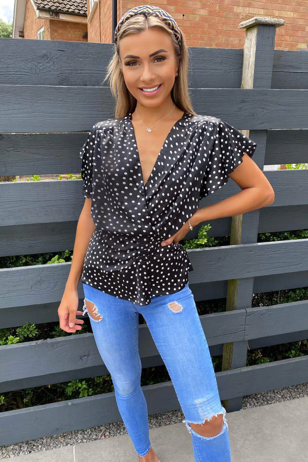 Black Polka Dot Wrap Top sold by AX Paris