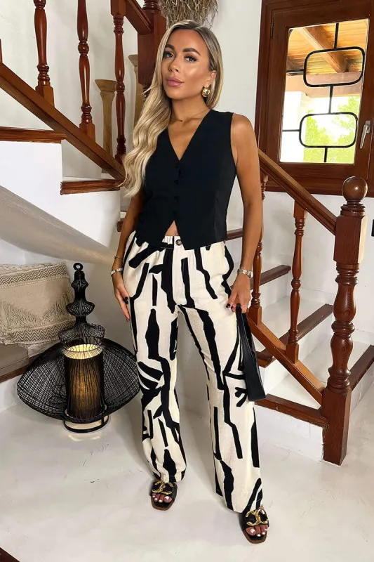 Cream And Black Abstract Print Wide Leg Trousers sold by AX Paris