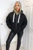 Black Fabric Hood Puffer Jacket sold by AX Paris