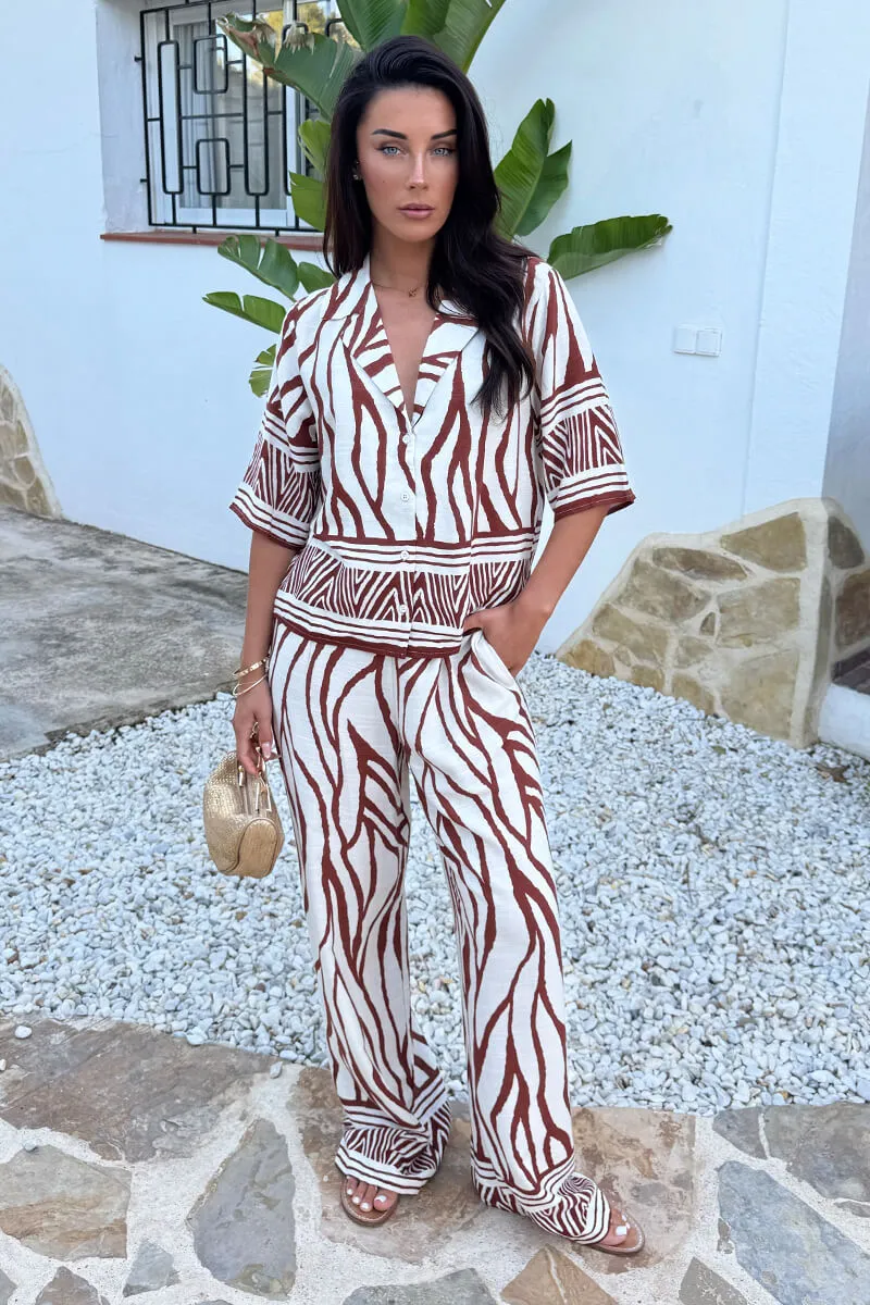 Cream And Brown Abstract Print Wide Leg Trousers sold by AX Paris