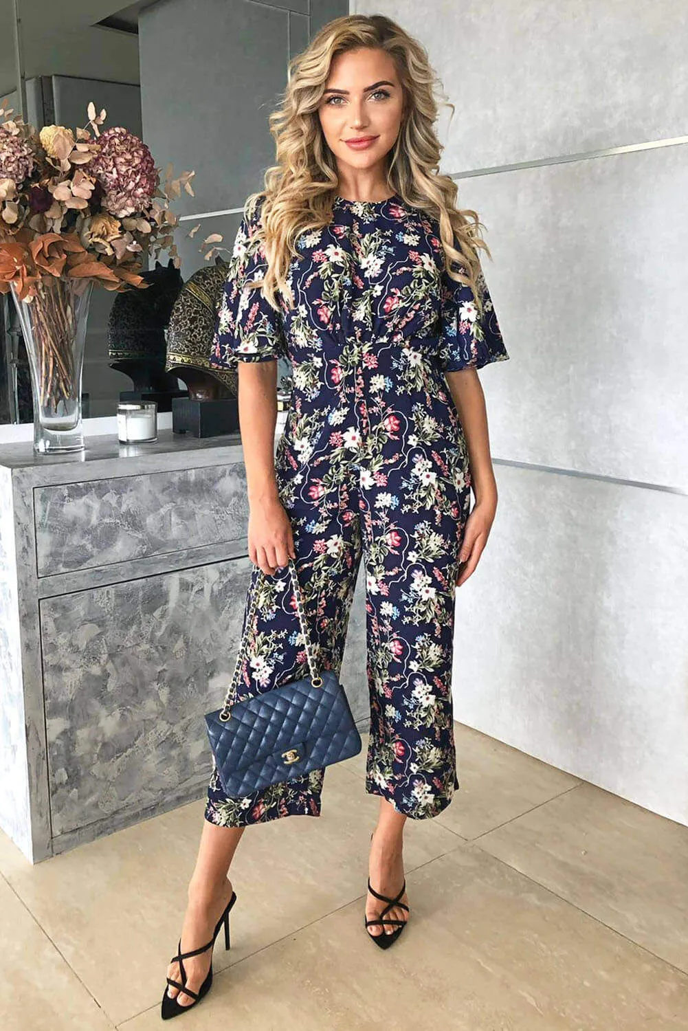 Navy Flared Leg Floral Jumpsuit sold by AX Paris