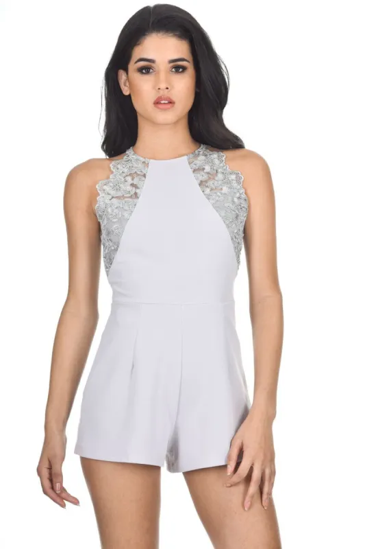 Silver lace playsuit sold by AX Paris