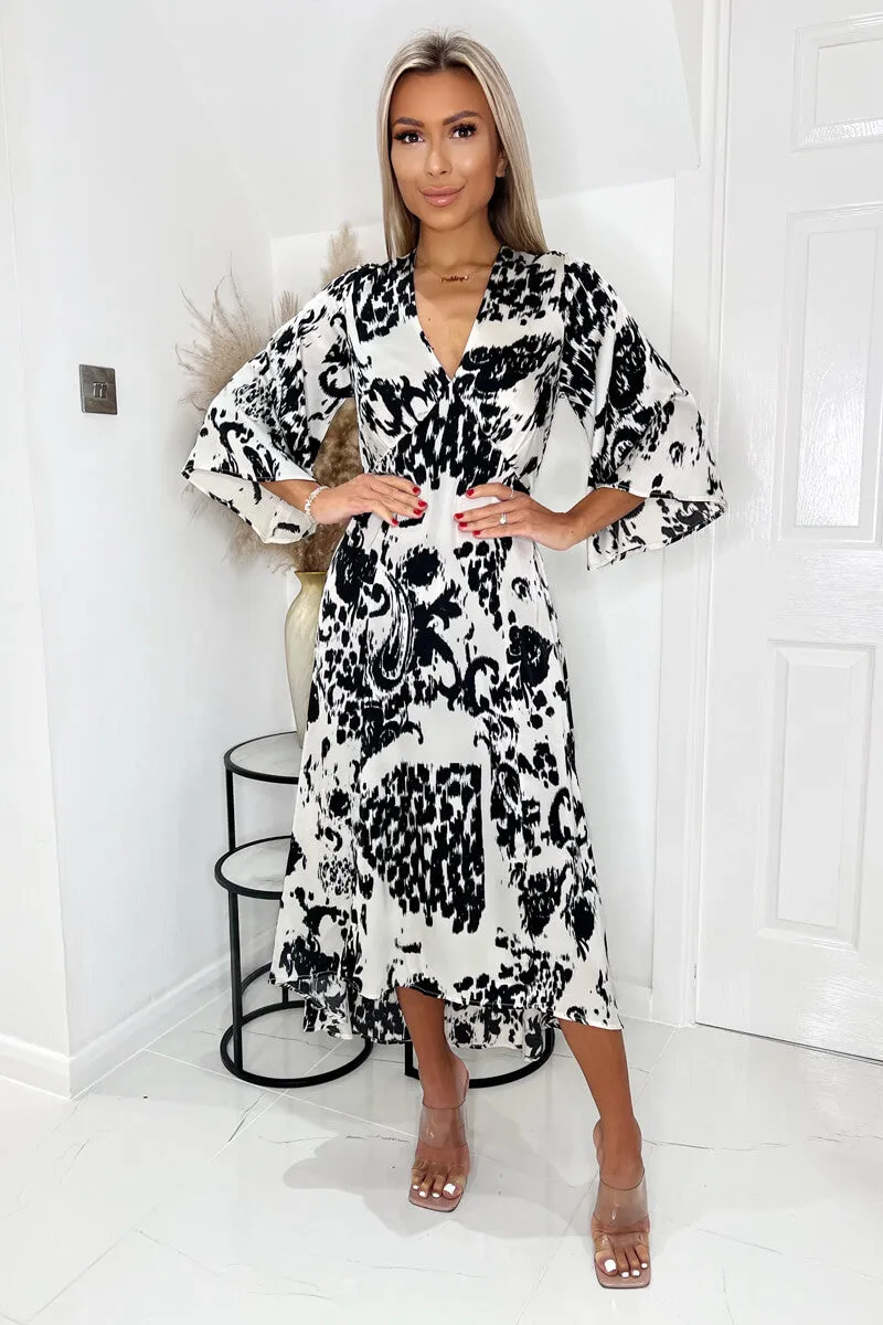 Black And Cream Printed V Neck Bell Sleeve Midi Dress sold by AX Paris