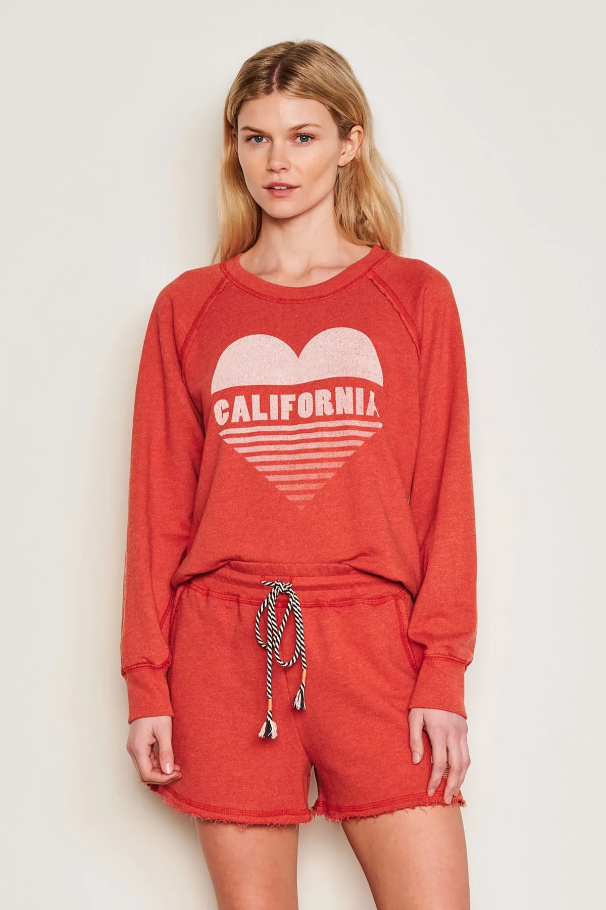 Sundry Cali Heart Raglan Sweatshirt in Burnt Red sold by Bailey 44