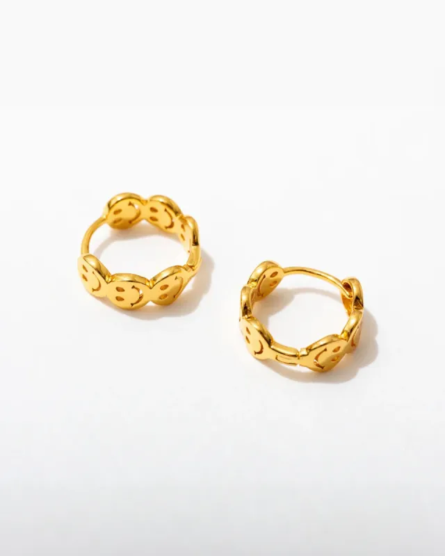Smiley Huggie Hoop Earrings sold by ban.do