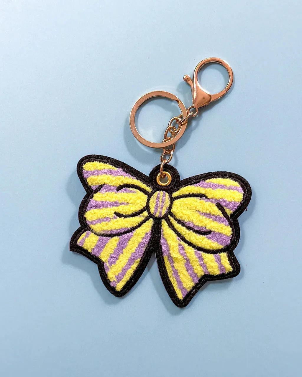 Purple + Yellow Striped Bow Bag Charm sold by ban.do