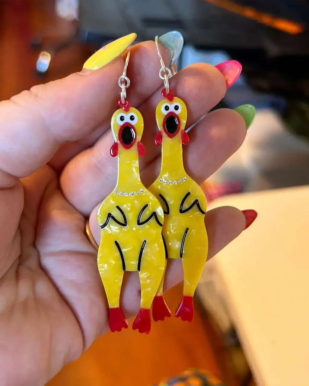 Rubber Chicken Earrings sold by ban.do