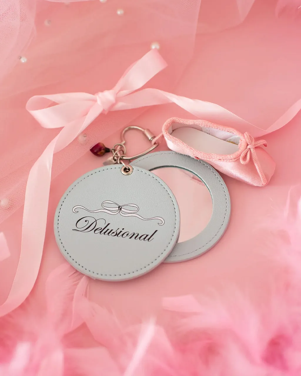 Delusional Mirror Keychain sold by ban.do