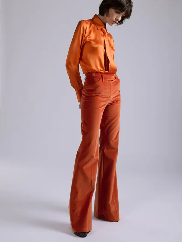 Pantalon flare en velours orange sold by Barbara Bui