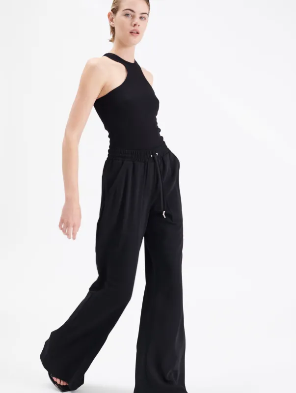 Pantalon jogger flare en crêpe sold by Barbara Bui