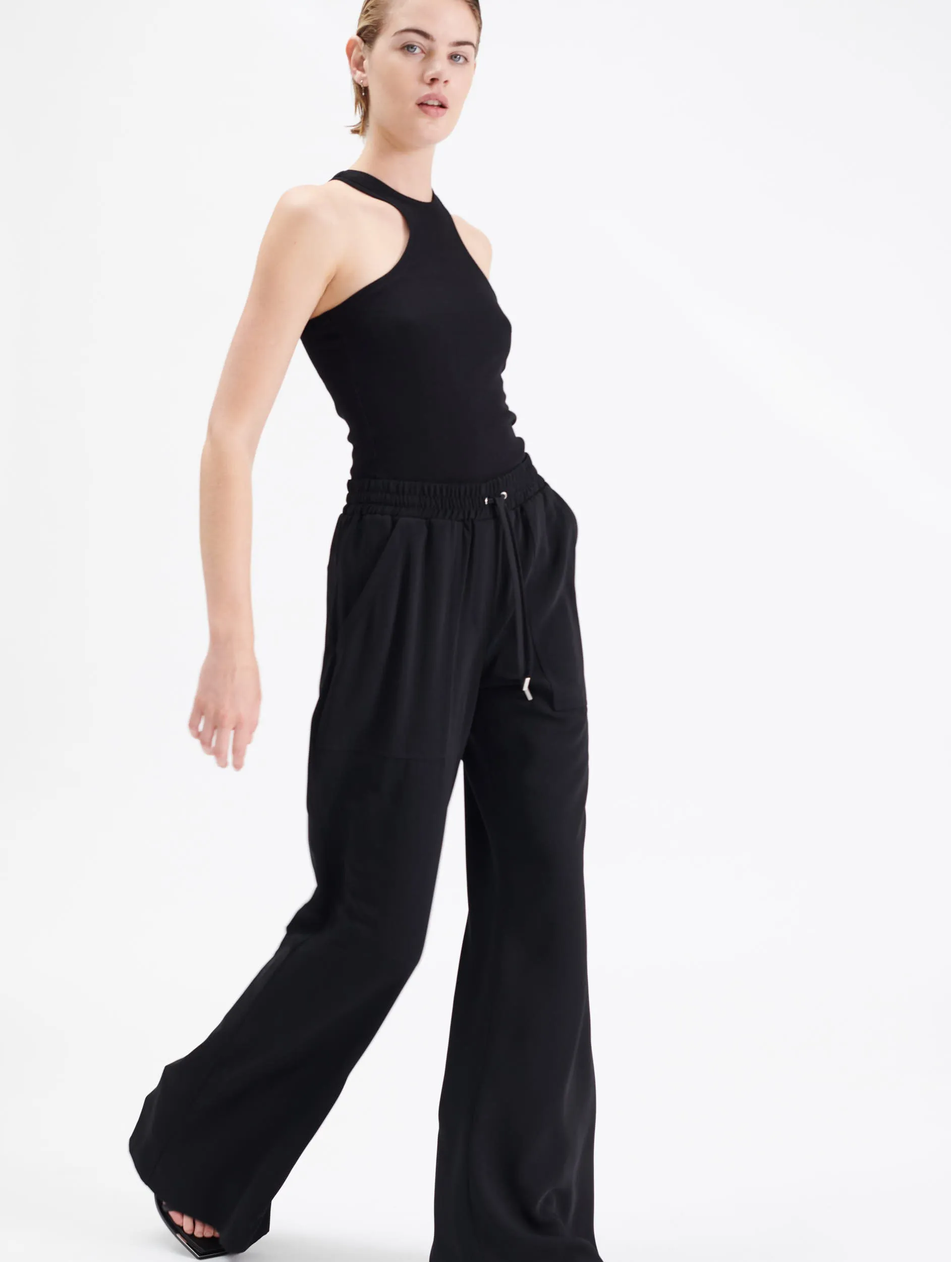 Pantalon jogger flare en crêpe sold by Barbara Bui