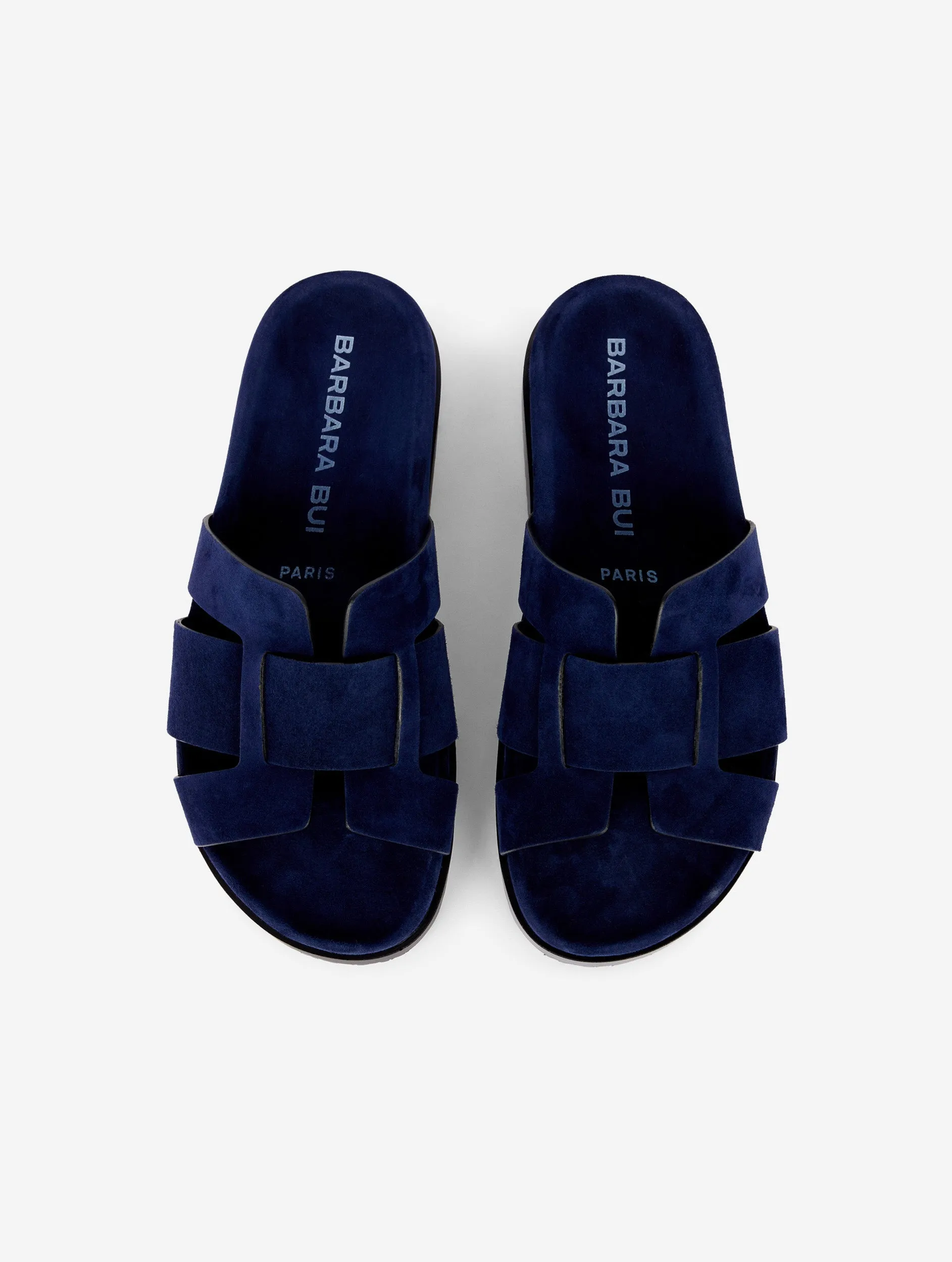 mules anatomiques en daim marine sold by Barbara Bui