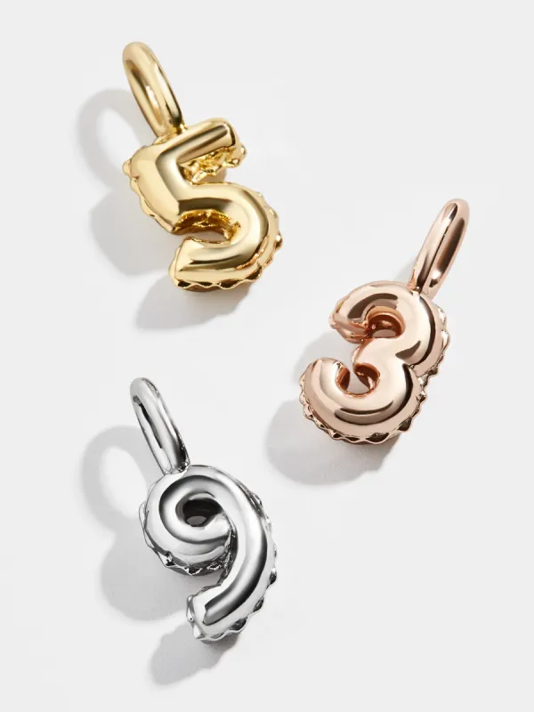Celebration Charm sold by BaubleBar