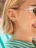 18K Gold Birthstone Huggie Earrings - Crystal sold by BaubleBar