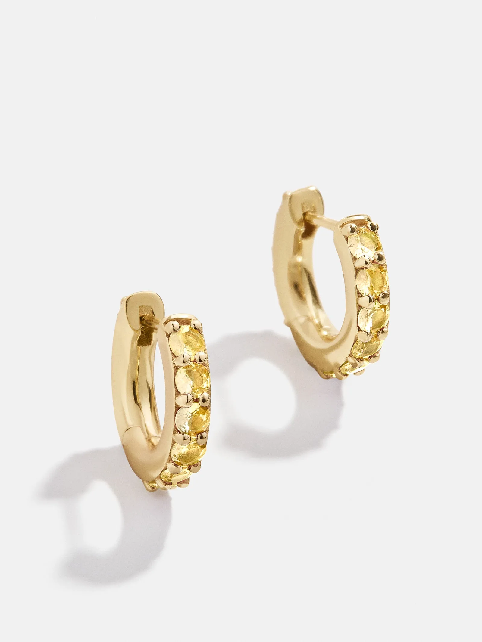 18K Gold Birthstone Huggie Earrings - Topaz sold by BaubleBar