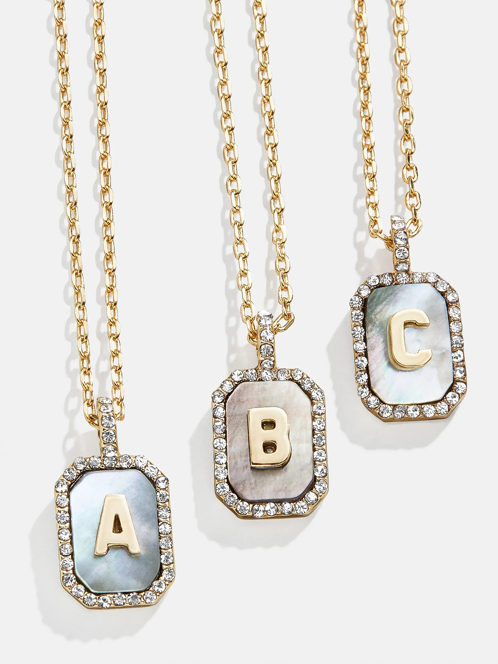 Gold & Mother Of Pearl Initial Necklace - Dark Mother Of Pearl sold by BaubleBar