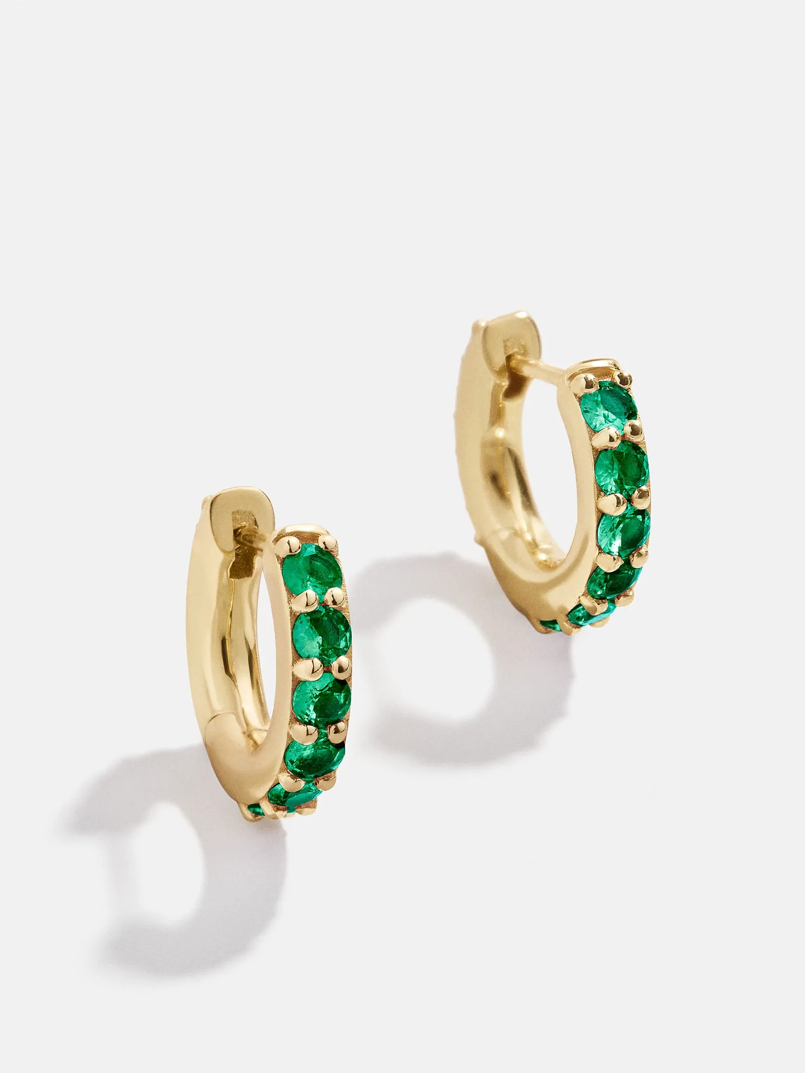 18K Gold Birthstone Huggie Earrings - Emerald sold by BaubleBar