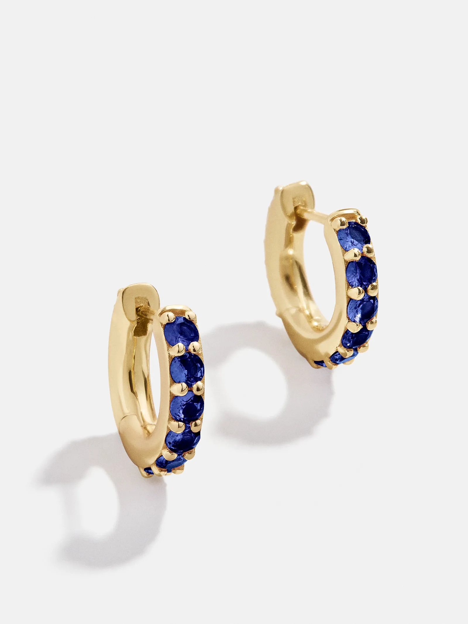 18K Gold Birthstone Huggie Earrings - Sapphire sold by BaubleBar
