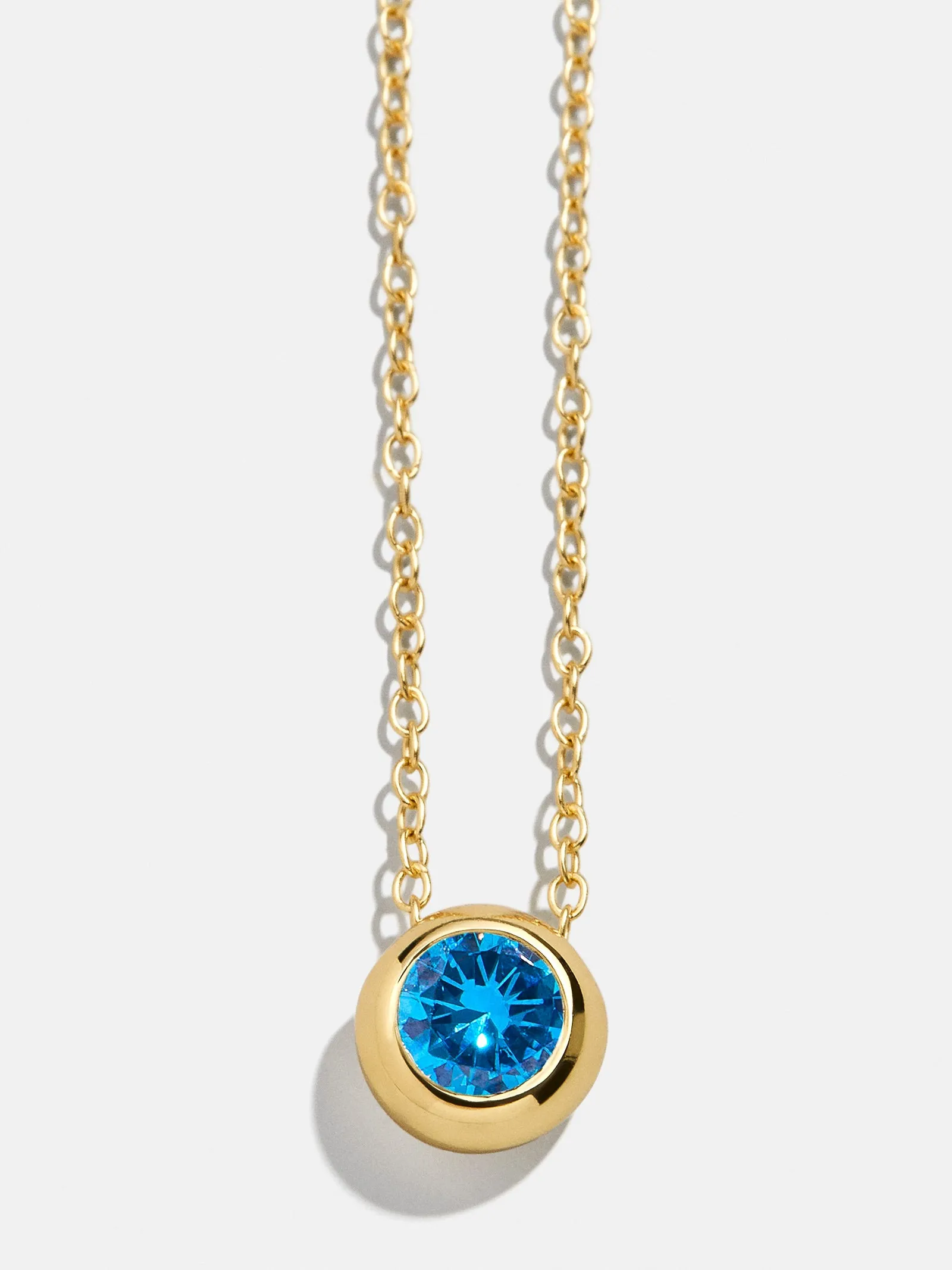 18K Gold Birthstone Pendant Necklace - Blue Zircon sold by BaubleBar