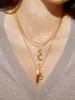 Classic Gold Initial Necklace - Gold Plated Brass sold by BaubleBar