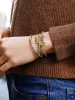 Disney Holiday Character Pisa Bracelet - Pluto sold by BaubleBar