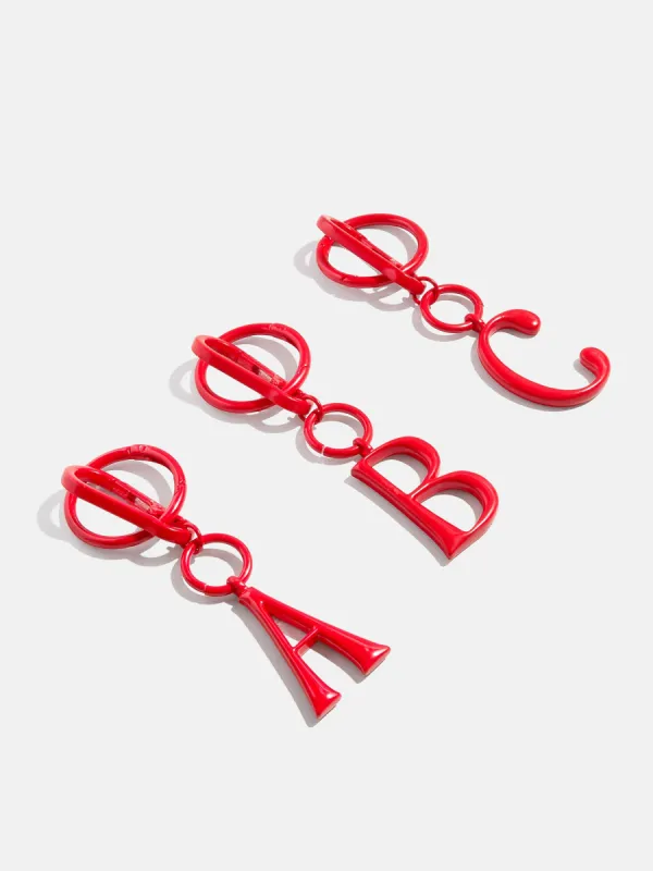Red Initial Enamel Bag Charm - D sold by BaubleBar