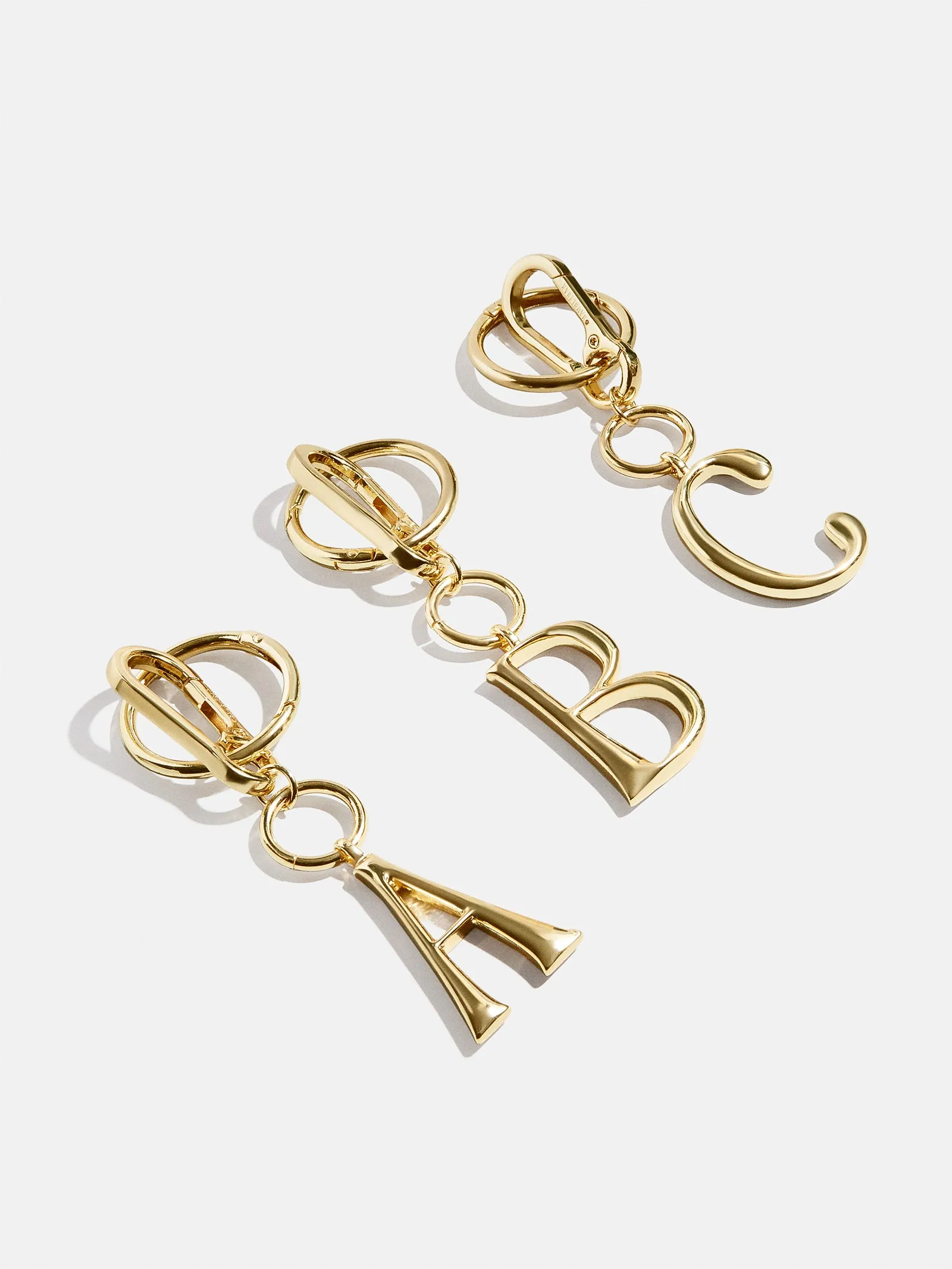 Initial Enamel Bag Charm - Gold sold by BaubleBar